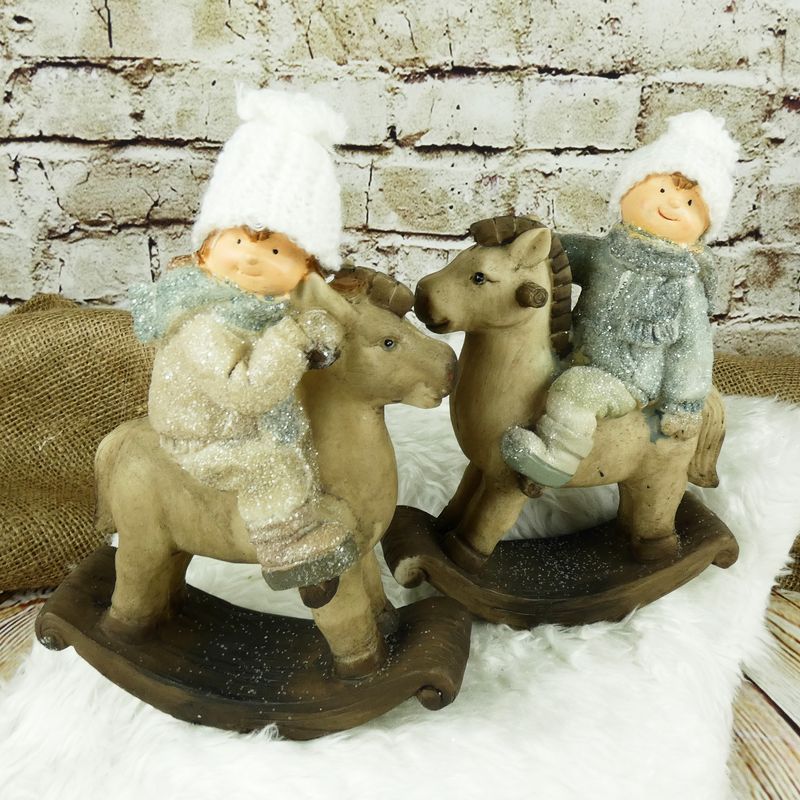 Zimní figurka- holčička na houpacím koni, 23 cm