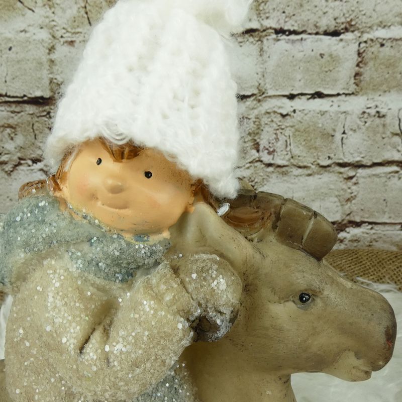Zimní figurka- holčička na houpacím koni, 23 cm